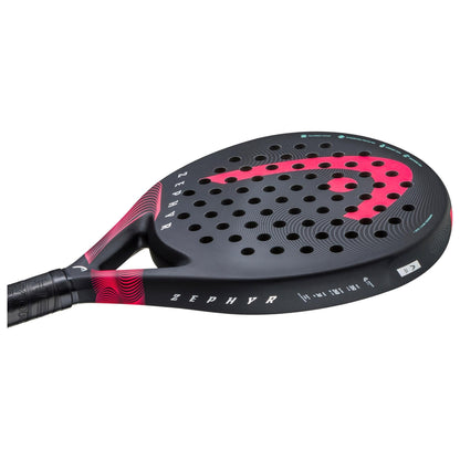 The HEAD Zephyr 2023 Padel Racket features a black and red design with a perforated surface, "ZEPHYR" on the side, curved red graphics, and subtle patterns on the black handle. Built with Graphene 360+ technology for extra power.