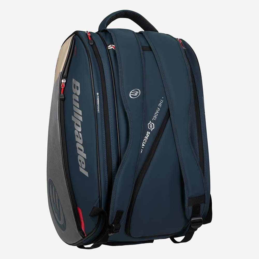 The Bullpadel BPP26017 Neuron Padel Racket Bag in grey features padded shoulder straps, multiple zippered compartments, and a side pocket, shown against a plain white background.
