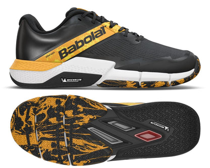 The Babolat Movea 2 Men's Padel Shoes in Black/Saffron feature a sleek design with "Babolat" branding. The side view showcases the detailed sole pattern, accented in black and saffron, while the Michelin Padel logo adds a touch of excellence on both the sides and sole.