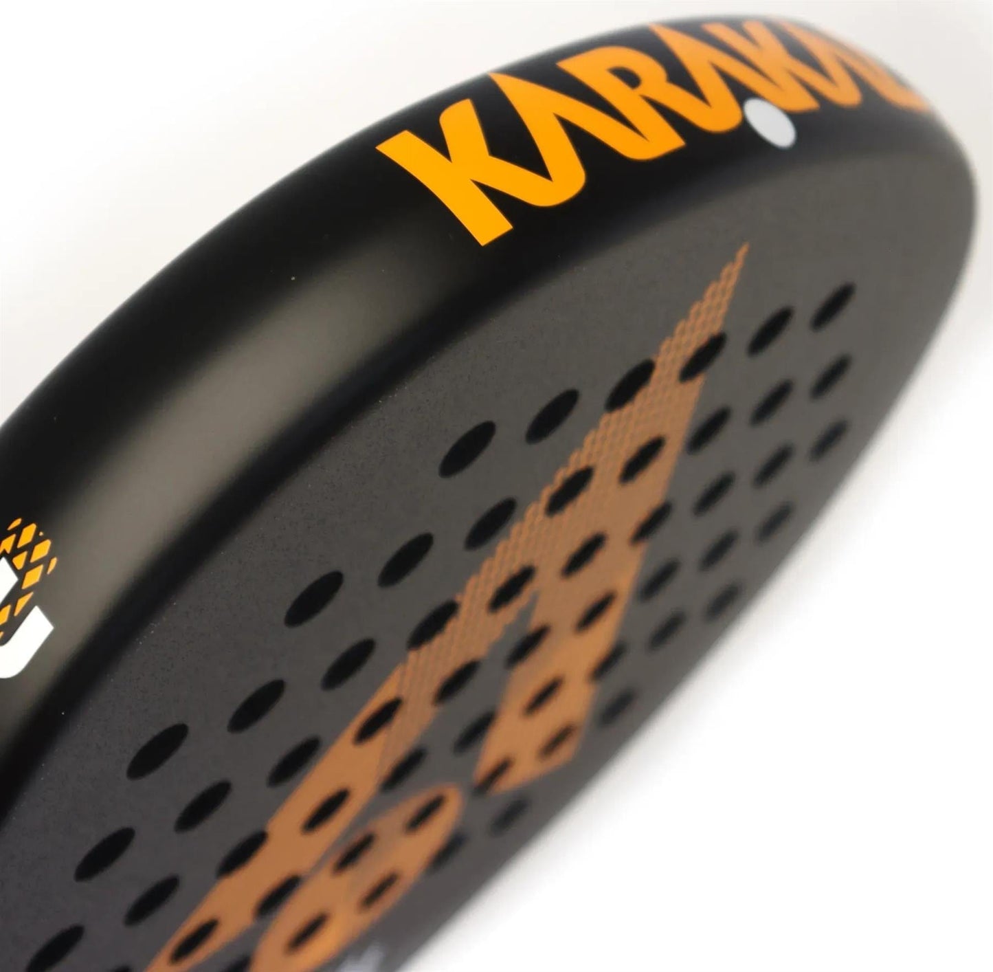 Close-up of the lightweight Karakal Air Lite 345 Orange Padel Racket, black with orange "Karakal" branding and graphics, featuring multiple small holes on its surface.