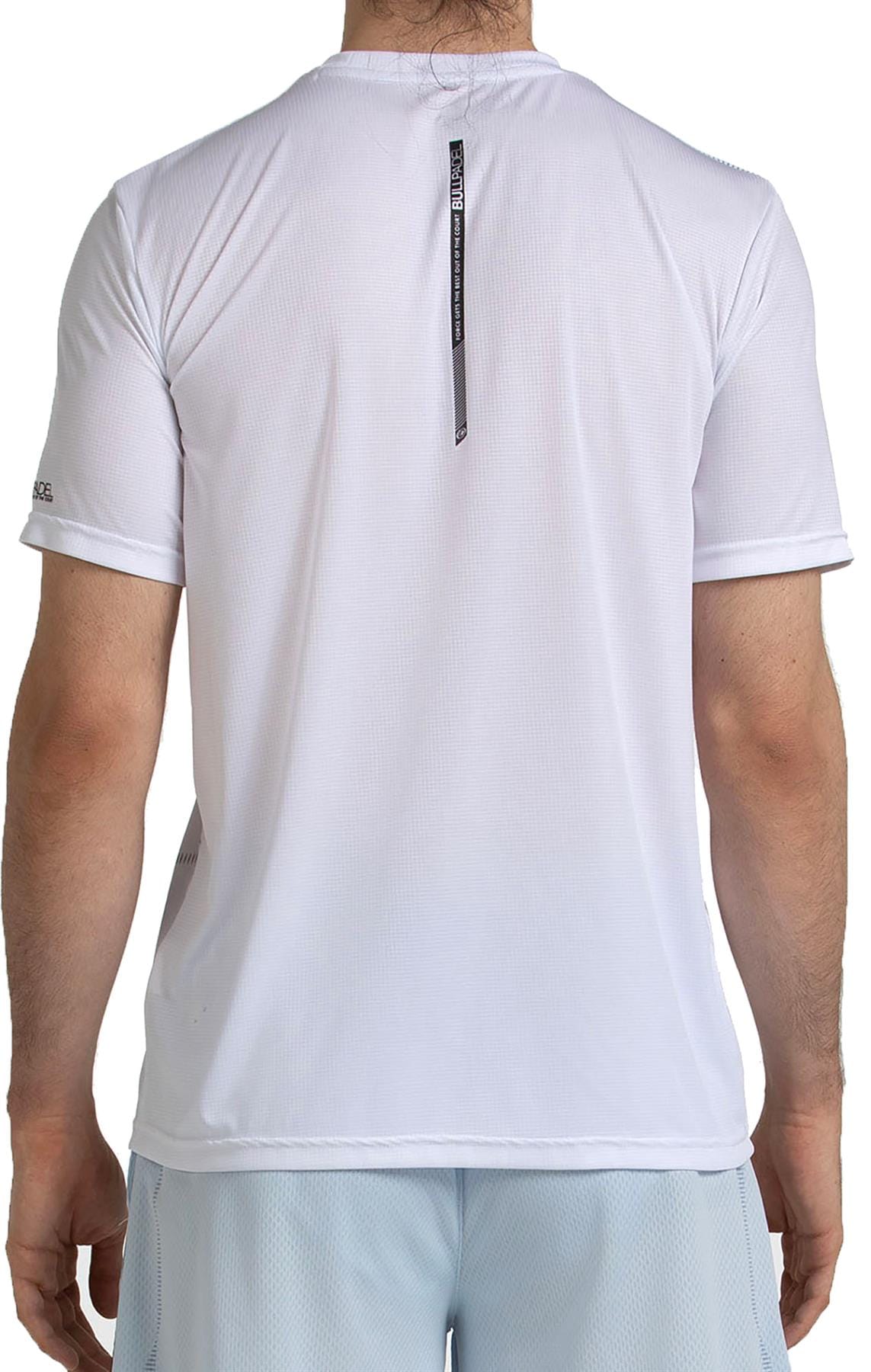 A person is shown from the back wearing a Bullpadel Casinas Mens Padel T-Shirt in white with light shorts. The shirt features QuickerDry technology and a small black tag hanging from the collar.