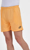 A man in Bullpadel Campaza Mens Padel Shorts - Orange, showcasing an elastic waistband and a small black Bullpadel logo on the left leg, is paired with a white shirt against a plain white background.