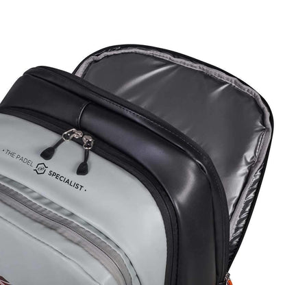 Close-up of the Bullpadel BPM26002 Hack Padel Backpack - Grey by Bullpadel, featuring light grey and black colors, an unzipped top showing a spacious silver-lined interior, and "THE PADEL SPECIALIST." text—ideal for Paquito Navarro fans.