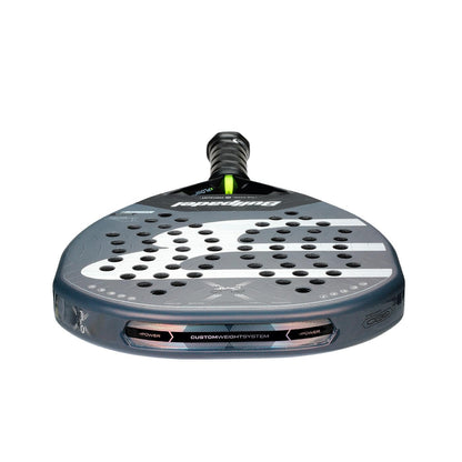 A close-up of the Bullpadel XPLO Comfort 2026 Padel Racket shows its perforated face, gripped handle, and bold Bullpadel branding—engineered for explosive power and standout comfort on the court.