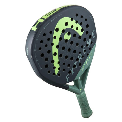 The HEAD Extreme Pro 2023 Padel Racket by HEAD features a black and green design with "EXTREME" on the face and round holes across the hitting surface, engineered for extreme power and advanced padel players.