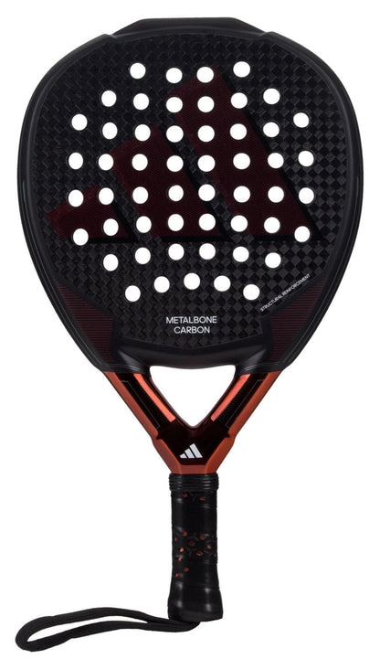 The adidas Metalbone Carbon 3.3 padel racket features a black and red design, perforated face, textured handle, wrist strap, and the adidas logo—ideal for advanced players seeking high performance.