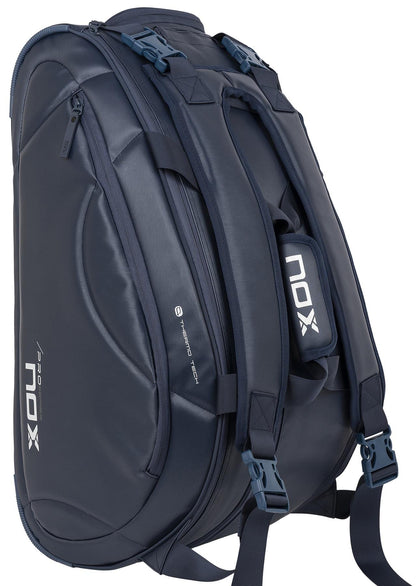 The NOX Pro Series Padel Racket Bag - Blue features multiple zippered compartments, padded shoulder straps, and the white NOX logo on the side and straps, combining sporty style with structured functionality.