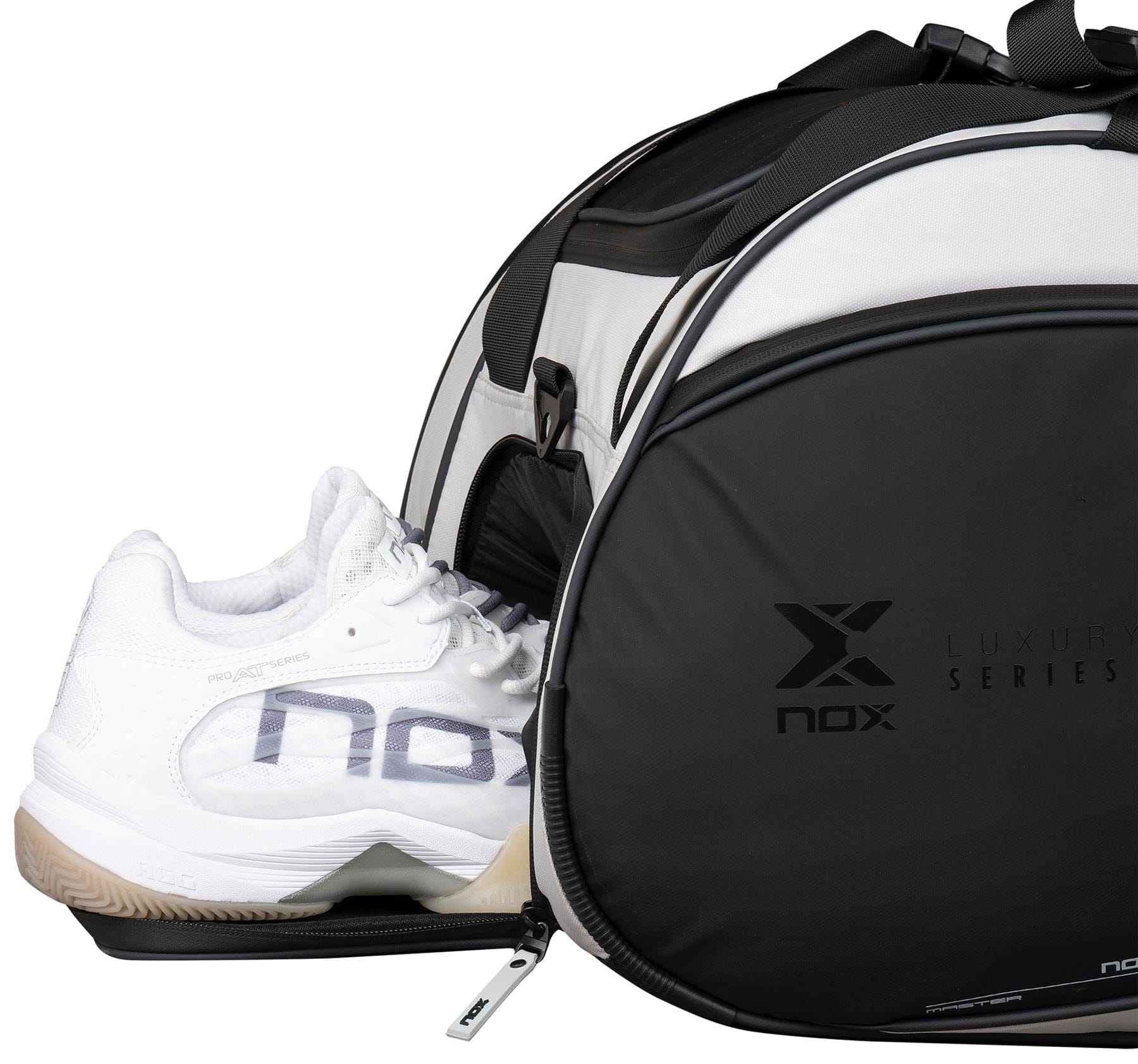 A black and white NOX Luxury Master Series Padel Racket Bag with "nox" branding is shown with a zippered compartment partially open, revealing white athletic shoes similar to those used by Miguel Lamperti.