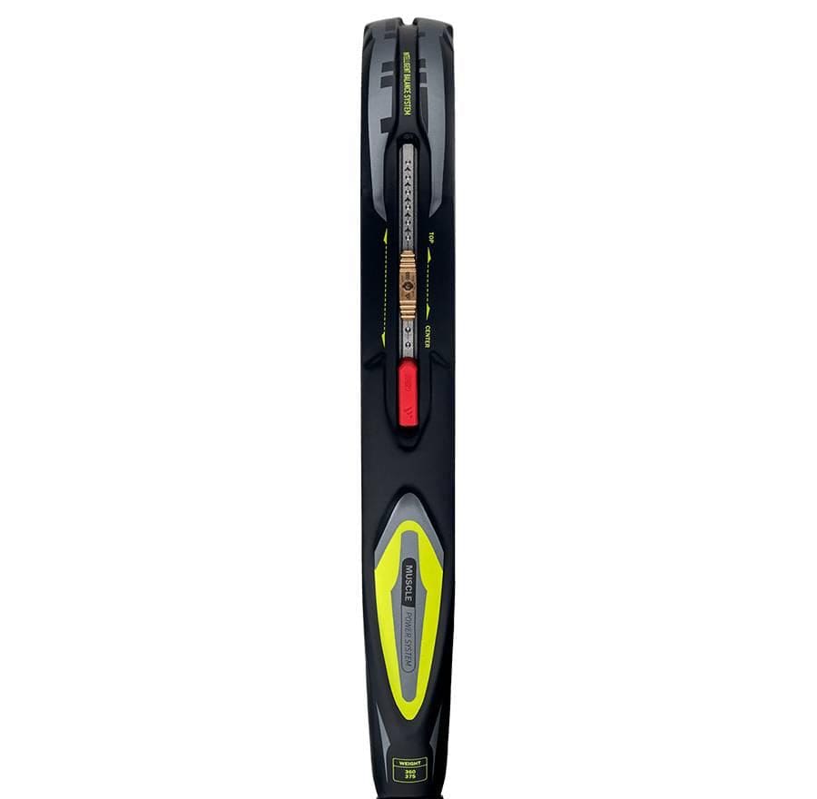 Close-up of the adidas Arrow Hit 2026 Padel Racket's side, highlighting its black and yellow design, detailed strings, grommets, padel power branding, and intelligent balance system on the frame.
