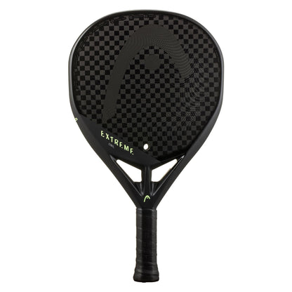The HEAD Extreme One 2023 Padel Racket by HEAD features a black design, checkered 12K carbon face, "EXTREME" in green on the shaft, and a lightweight build with a black grip handle.