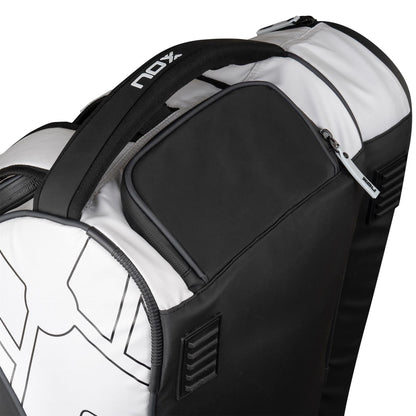 Close-up of the NOX Luxury Master Series Padel Racket Bag in black and white, featuring a zippered pocket, padded handle, and "NOX" logo on the strap—an ideal pick for fans of premium NOX gear.