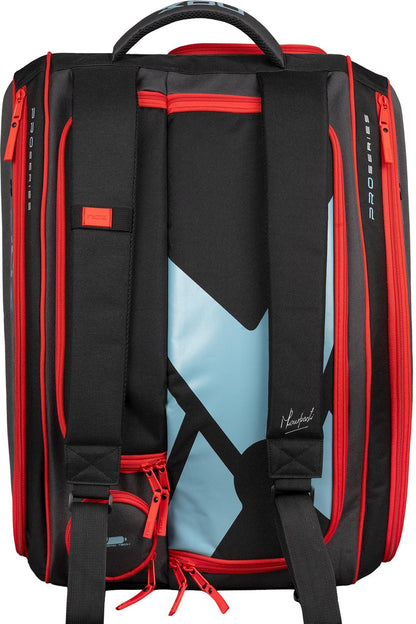 The NOX ML10 Team Padel Racket Bag - Black / Clay is shown from the back with padded shoulder straps, a top handle, red zippers, and a bold geometric design. Multiple zippered compartments offer storage for padel gear.
