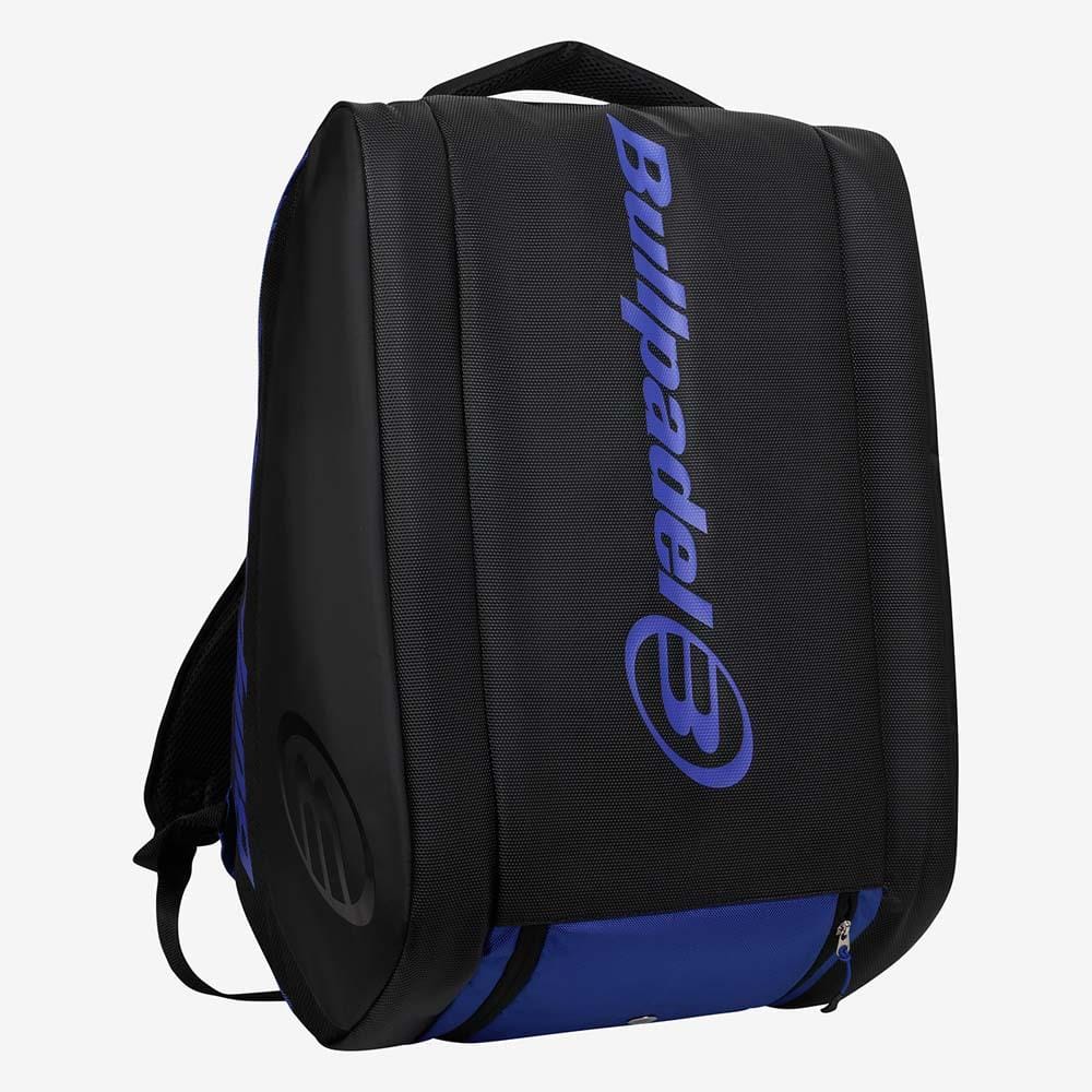 The Bullpadel BPP26002 Vertex Padel Racket Bag - Geo Blue stands upright, displaying the bold blue Bullpadel logo and name on the front, plus a zippered bottom pocket and top handle for storing your padel gear.