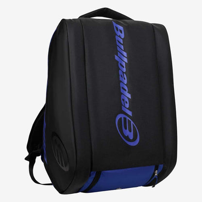 The Bullpadel BPP26002 Vertex Padel Racket Bag - Geo Blue stands upright, displaying the bold blue Bullpadel logo and name on the front, plus a zippered bottom pocket and top handle for storing your padel gear.