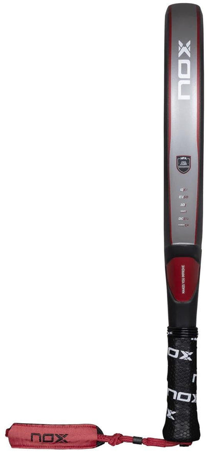 The NOX NFA Future Attack 12K Alum Padel Racket is a black and red model with a long handle, ergonomic grip, and wrist strap—ideal for players seeking more power. Branding and specs are visible on the shaft.