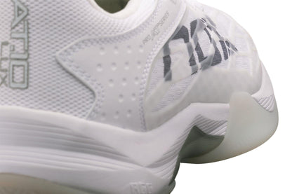 Close-up of the NOX AT10 Lux Men's Padel Shoes in White/Grey, designed for Agustin Tapia. These premium shoes from NOX feature textured details, mesh panels, a thick curved sole with translucent rubber, and a black logo on the side.