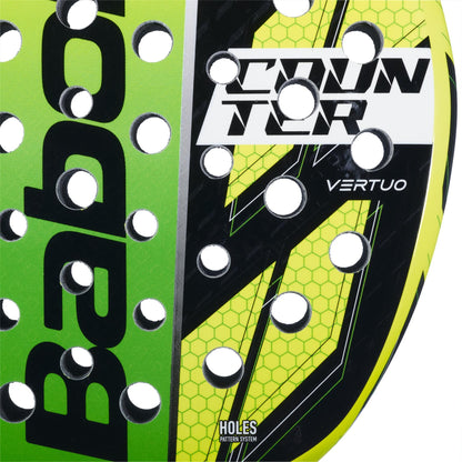 Close-up of the Babolat Counter Vertuo Padel Racket by Babolat, showcasing "COUNTER" and "VERTUO" text, an easy power design in black, green, and yellow, hexagon patterns, and multiple holes.