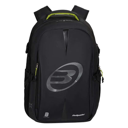 The Bullpadel BPM26022 XPLO Padel Backpack - Black features padded straps, side pockets, and green zipper pulls. Inspired by Martín Di Nenno, it displays a bold "B" logo and "Bullpadel" branding on the front.