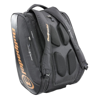 The Bullpadel Vertex 25 Padel Racket Bag in black features padded shoulder straps, multiple zippered compartments, and a ventilated section for sports gear, with orange Bullpadel branding on the side to match your Vertex Padel Racket.