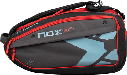 The NOX ML10 Competition XL Compact Padel Racket Bag in black/red features multiple zip compartments, a shoulder strap, a blue geometric design, red zippers, and "NOX ML10 Pro Series" printed on the side.