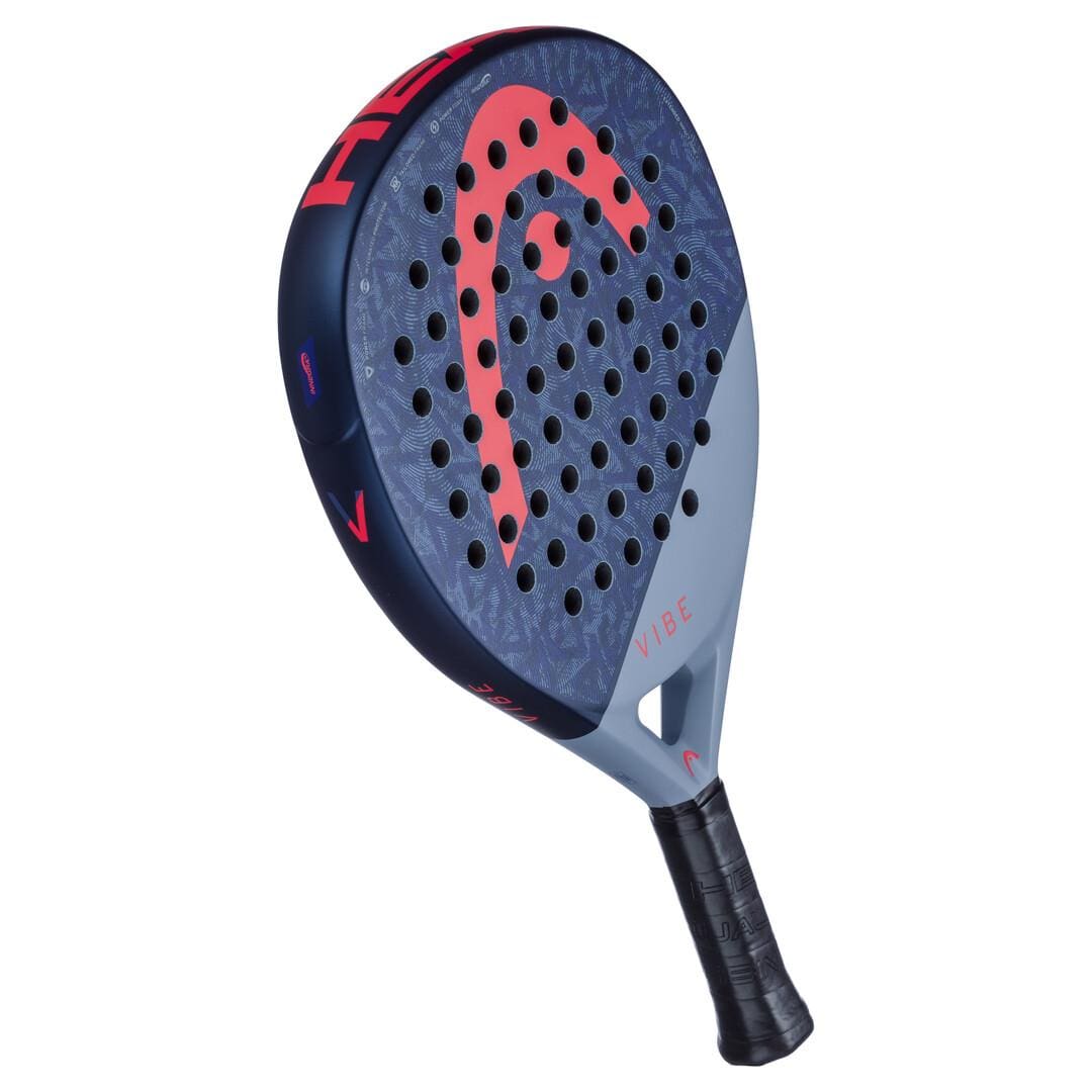 A close-up of the HEAD Vibe 2025 Blue / Red Padel Racket shows its oversized teardrop shape, blue and gray colors, bold red HEAD logo, black grip, multiple holes on the face, and “VIBE” printed near the handle.