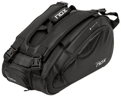 The NOX Pro Series Padel Racket Bag - Black offers large storage, multiple compartments, durable zippers, adjustable straps, and NOX ThermoTech technology—perfect for carrying your sports equipment.