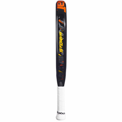 The Babolat Storm Padel Racket features a black teardrop design, bold orange and yellow "STORM" branding on the shaft, a white grip, and is ideal for beginners.