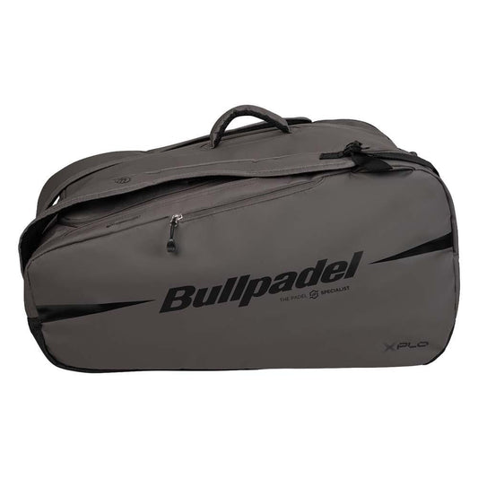 The Bullpadel BPP26022 XPLO Padel Racket Bag in grey features black zippers, handles, bold "Bullpadel" branding on the side, thermal racket compartments, and "XPLO" printed in the lower right corner.