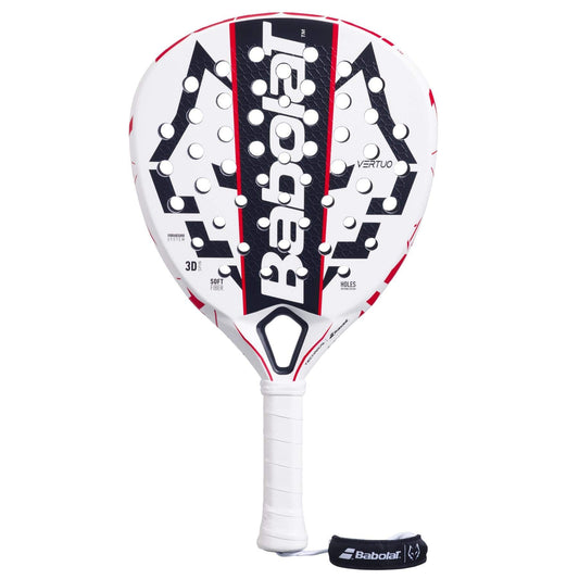 The Babolat Technical Vertuo Juan Lebrón Padel Racket features a white design with black and red accents, circular holes, a black Babolat logo on the face, a white grip-wrapped handle, and an attached black wrist strap.