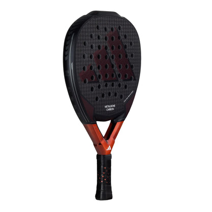 The adidas Metalbone Carbon 3.3 Padel Racket is a black and red racket with a perforated carbon fiber surface, made for advanced players and featuring the adidas logo on its frame and grip.