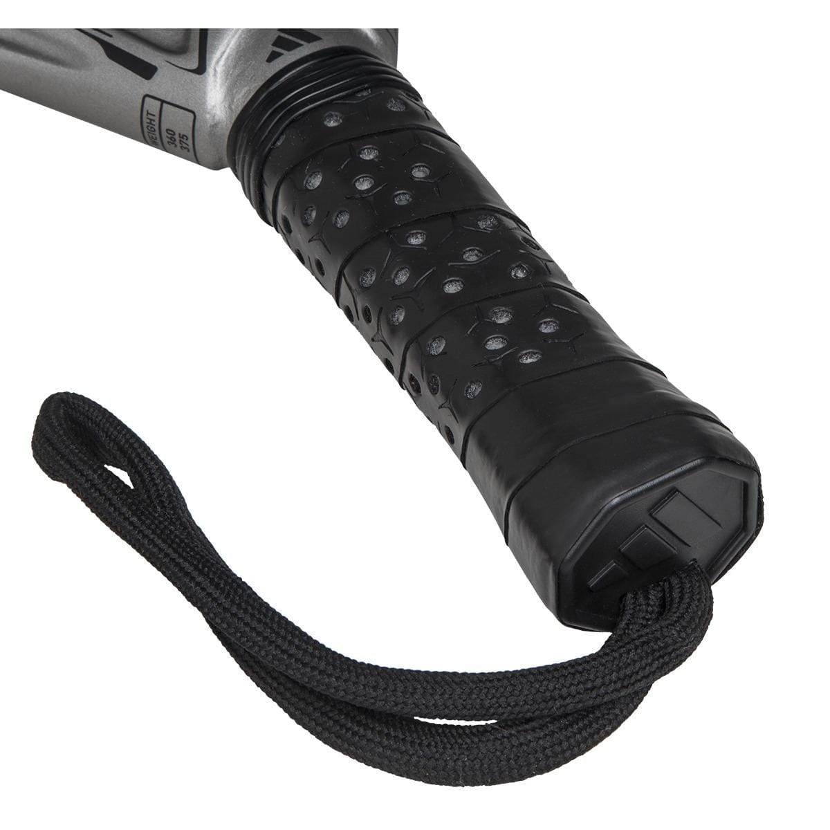 Close-up of the adidas ADIDAS Adipower Carbon CTRL 3.4 Padel Racket handle, featuring a black and silver textured grip, 18K carbon detailing, and a black wrist strap at the end.