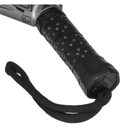 Close-up of the adidas ADIDAS Adipower Carbon CTRL 3.4 Padel Racket handle, featuring a black and silver textured grip, 18K carbon detailing, and a black wrist strap at the end.