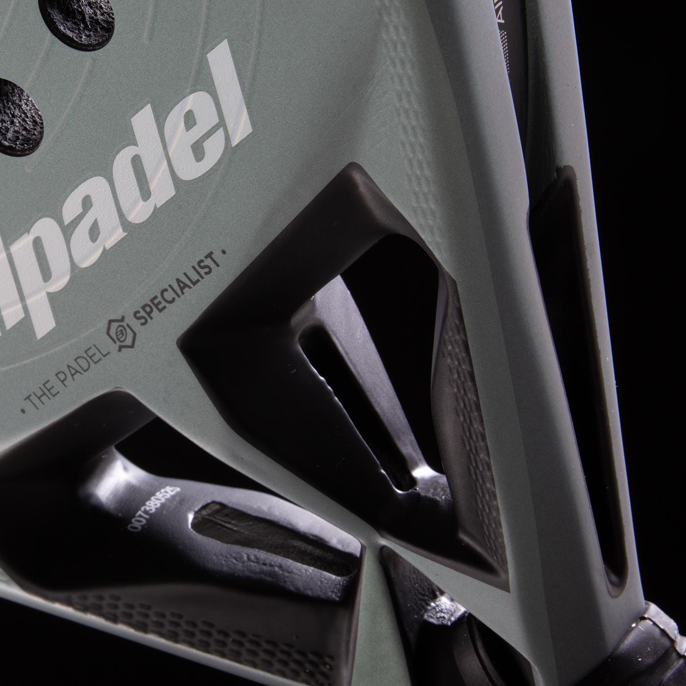 Close-up of the Bullpadel HACK 04 2026 padel racket, featuring angular cut-out details and dynamic power, with the white "padel" logo and "THE PADEL SPECIALIST" text from Bullpadel visible on its surface.