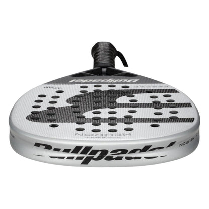A close-up of the Bullpadel Neuron 2025 Padel Racket shows its white and black design with perforated face, Bullpadel logo on the edge, and a black-gripped handle, as used by professional player Federico Chingotto.