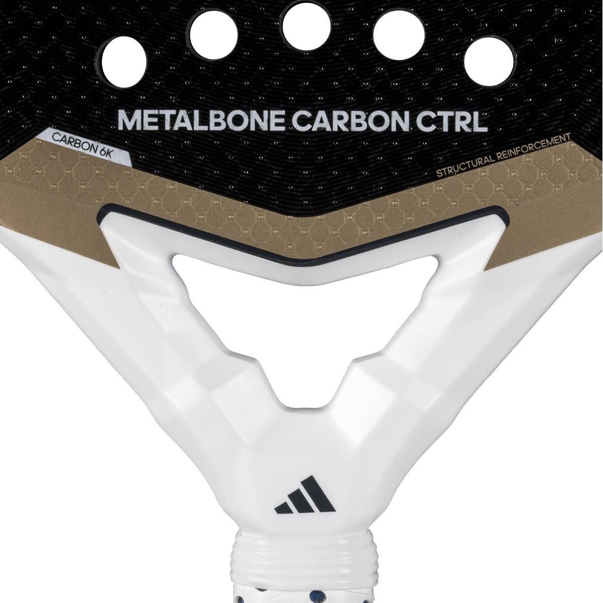 Close-up of the adidas Metalbone Carbon CTRL 3.4 padel racket for advanced players, labeled "METALBONE CARBON CTRL" with "CARBON 6K," "STRUCTURAL REINFORCEMENT," round holes, and the adidas logo near the handle.