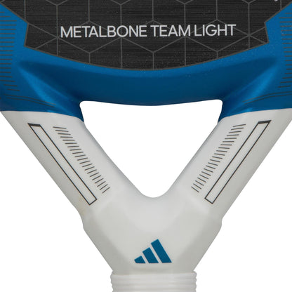 Close-up of the lightweight adidas Metalbone Team Light 3.3 Padel Racket, featuring "METALBONE TEAM LIGHT" on the face and the adidas logo at the handle base.