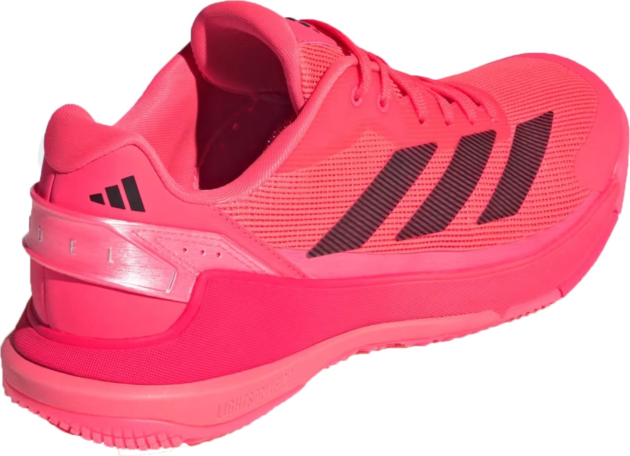 The adidas Crazyquick LS Men's Padel Shoes in Solar Turbo, Core Black, and Lucid Red feature black stripes, breathable mesh, a textured sole for grip, low-cut design, visible laces, and adidas branding near the heel for a sporty look.