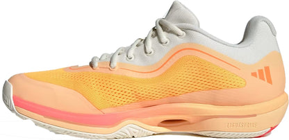 Side view of the adidas Crazyflight 7 Indoor Mens Padel Shoes in Lucid Tangerine, Lucid Orange, and Off White with white laces, mesh upper, textured sole featuring LightstrikePro cushioning, and a subtle adidas logo on the heel.