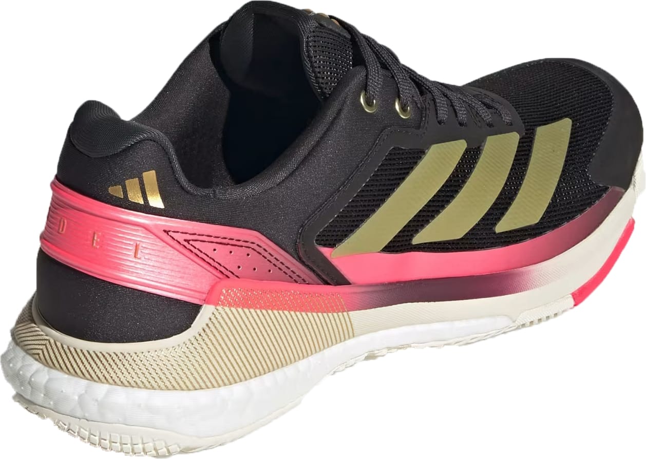 The adidas Crazyquick Boost Men’s Padel Shoes in Core Black/Gold Metallic/Solar Turbo feature a mesh upper, gold stripes, white sole, pink accents, and visible branding for standout style and energy return.