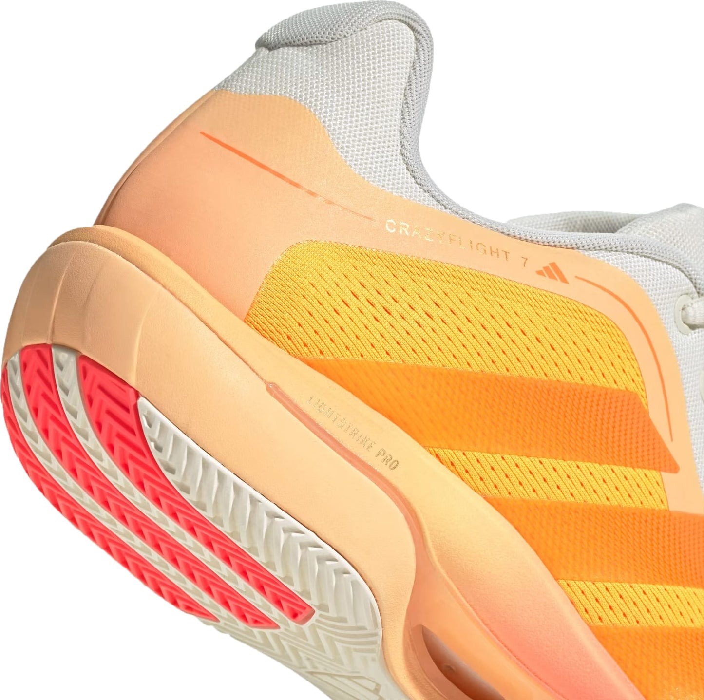 Close-up of the adidas Crazyflight 7 Indoor Men's Padel Shoes in Lucid Tangerine/Lucid Orange/Off White, showing a yellow mesh upper, orange gradient midsole, red and white outsole, LightstrikePro cushioning, and bold adidas stripes.