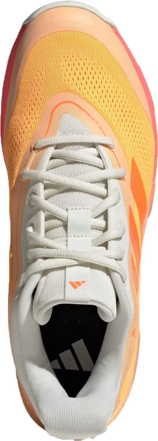 Top-down view of an adidas Crazyflight 7 Indoor Men's Padel Shoe in Lucid Tangerine/Lucid Orange/Off White with a white tongue and laces, orange-yellow mesh upper, pink-orange sole, subtle branding, and responsive LightstrikePro cushioning.