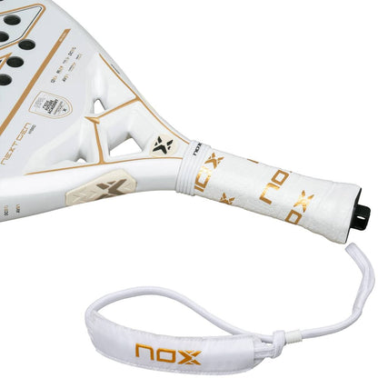 Close-up of the NOX NextGen Pro Hybrid 12K NFA 2026 padel racket handle, showing NOX branding, a perforated grip, wrist strap, and a durable 12K Carbon Face—ideal for advanced players.