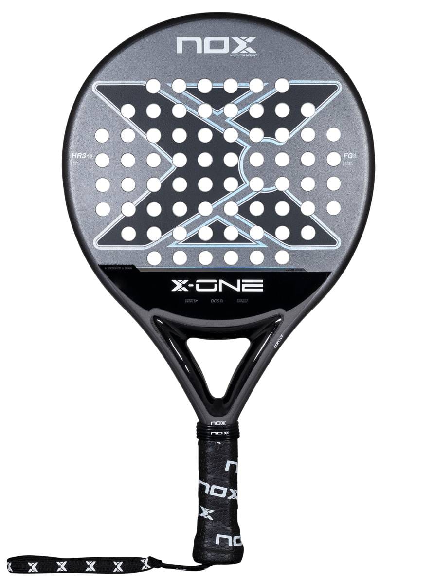 The NOX X-One 2026 Padel Racket by NOX features a black and gray design, circular perforated face with a large X pattern, branded wrist strap, and top logo—perfect for beginners seeking control.