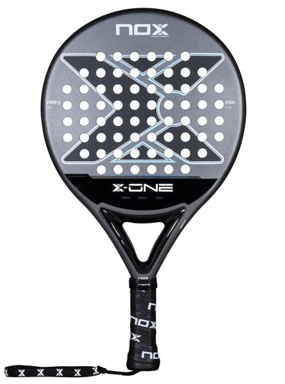 The NOX X-One 2026 Padel Racket by NOX features a black and gray design, circular perforated face with a large X pattern, branded wrist strap, and top logo—perfect for beginners seeking control.