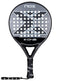 The NOX X-One 2026 Padel Racket by NOX features a black and gray design, circular perforated face with a large X pattern, branded wrist strap, and top logo—perfect for beginners seeking control.