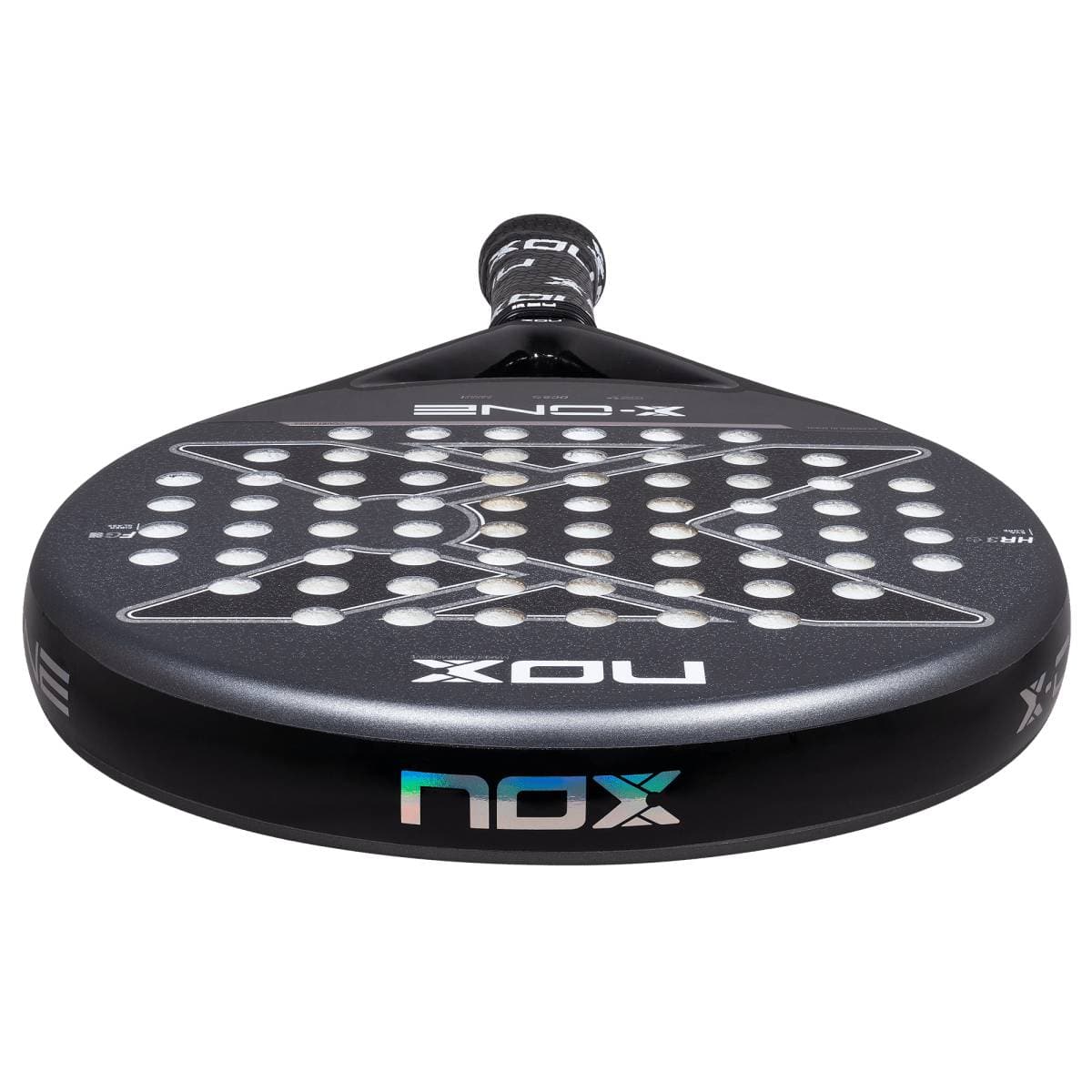 Close-up of the NOX X-One 2026 Padel Racket, displaying its perforated face with circular holes and NOX logos—perfect for beginner players wanting enhanced control.