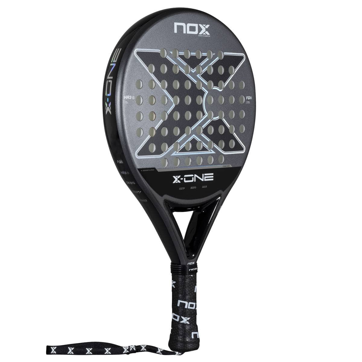 The NOX X-One 2026 Padel Racket is black and gray with a perforated round face, NOX branding, and a black grip with branded wrist strap. Perfect for beginners seeking control. Background is white.
