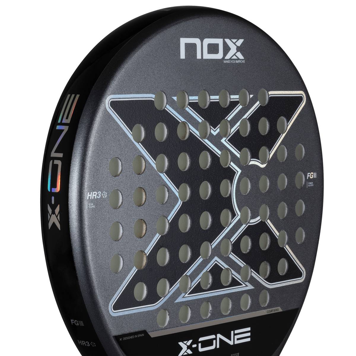 Close-up of the NOX X-One 2026 Padel Racket, featuring a control-focused black design with a large X in the center, circular perforations, and NOX branding—ideal for beginner players.