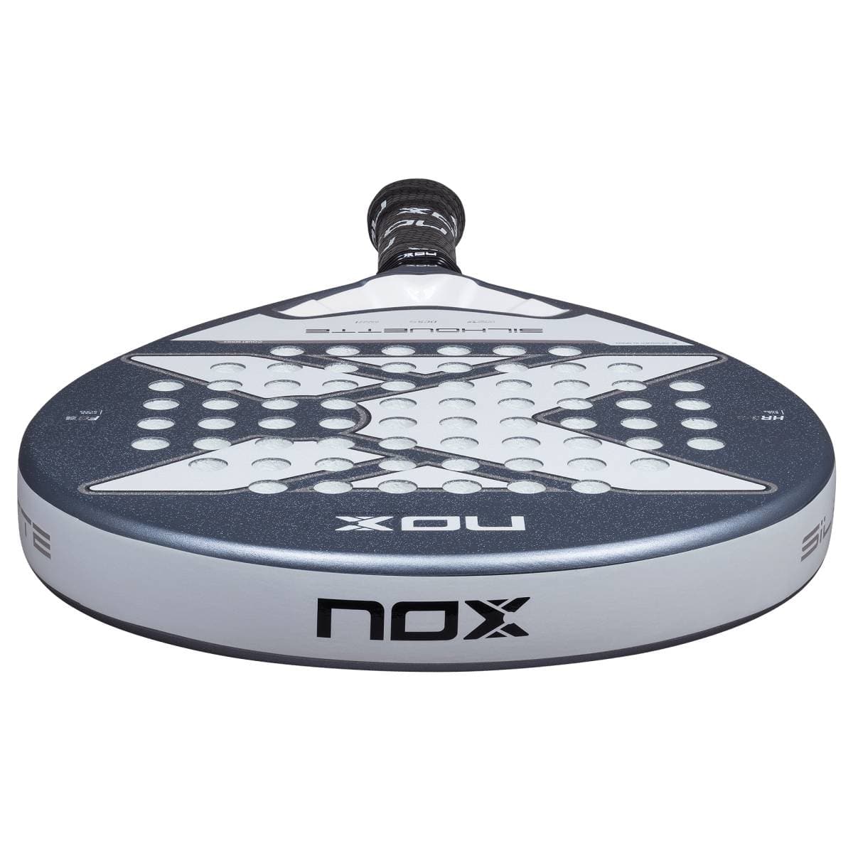 A close-up of the NOX X-One Silhouette 2026 Padel Racket highlights its round head, gray and white design, multiple holes, and "NOX" branding—making it an ideal choice for beginner players.